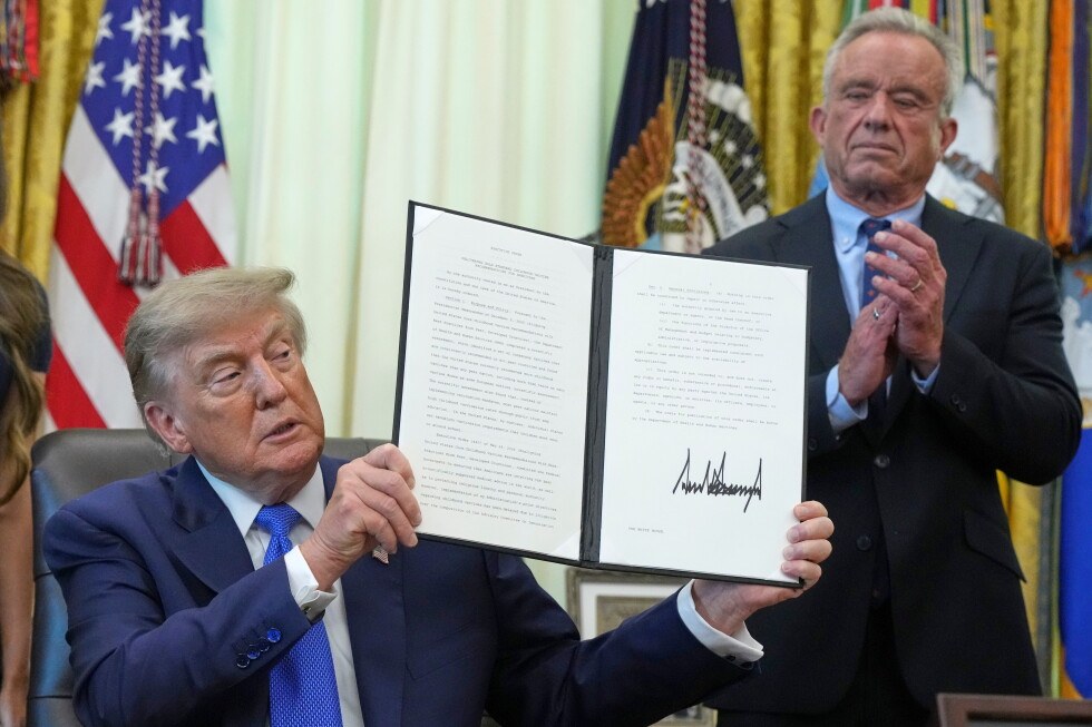 Trump signs an order urging fewer childhood vaccines and says the MMR shot could be "quite lethal"